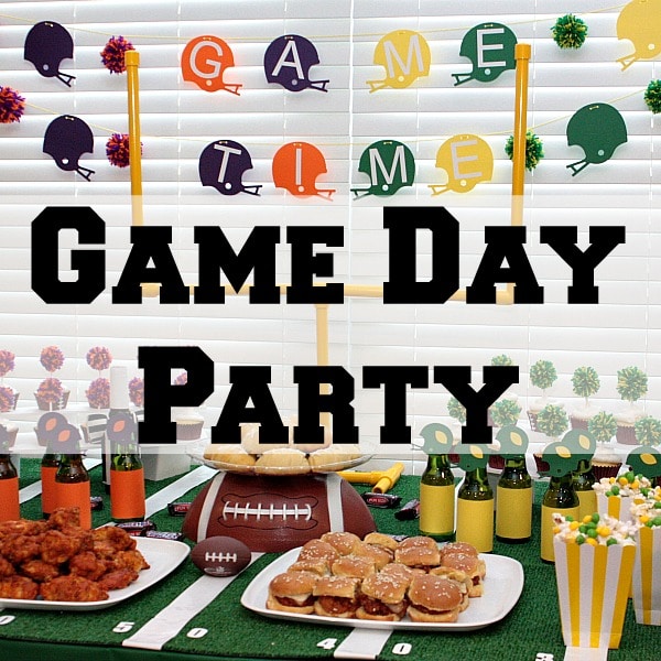 When we can’t make it to the football game for tailgating we bring the party to our living room with a little homegating! We go all out with fun game day decorations and game day recipes. Table goals, snickers crescent rolls, skittles popcorn, and a table that looks like a football field, we are ready to party!