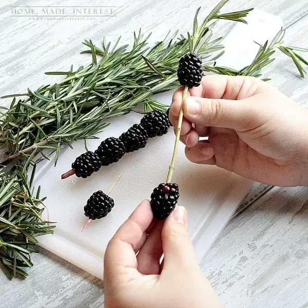 This is a fun alcoholic drink recipe is made with blackberries and Canada Dry Ginger Ale® fancied up with a blackberry and rosemary skewer. Beautiful and delicious!
