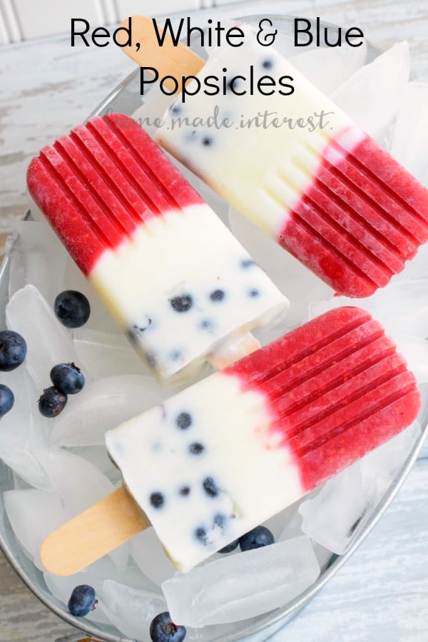 These Red White and Blue Popsicles are made fresh summer fruit, raspberries & blueberries, for a delicious, cool dessert for Memorial Day, 4th of July, or Labor Day! Kids and adults will love these all natural, fruit and yogurt popsicles at all of your summer parties. 