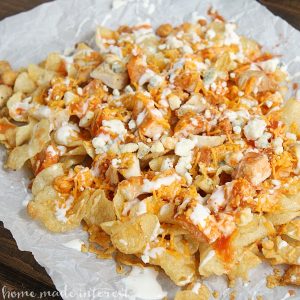 This easy buffalo chicken nacho recipe is perfect for game day and makes a simple party food that your guests are going love!