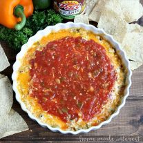 This Mexican sunset dip is a tasty mix of cheese, green chilies, Mexican chorizo, and salsa. It is such a simple recipe to make for parties.