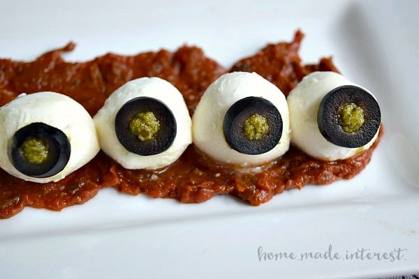 Looking for an easy recipe for Halloween? These mozzarella eyeballs are a creepy recipe that everyone will love!