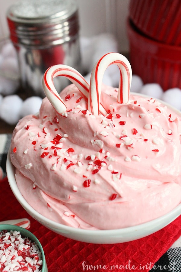 This easy no bake peppermint fluff dip is an easy dessert recipe that even the kids can make! Crush peppermints and creamy marshmallow fluff make this dip perfect for Christmas dessert! If you like marshmallow fluff and cream cheese together you are going to love this peppermint dessert.