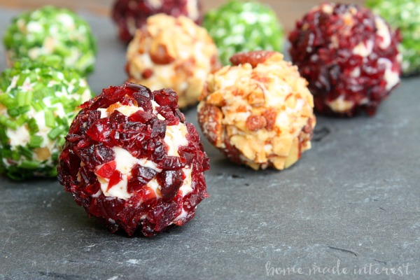 These mini cheese balls are an easy appetizer recipe that everyone will love. We have three simple cheese ball recipes with cranberries, almonds, and chives.