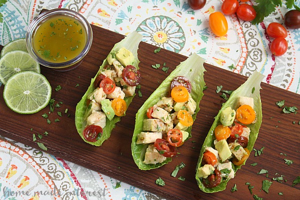 If you want a light, low carb lunch option this chicken and avocado salad is one of my favorites. Grilled, or baked chicken, fresh avocado and tomatoes, and a light lime cilantro vinaigrette, in a simple lettuce wrap makes the perfect lunch.
