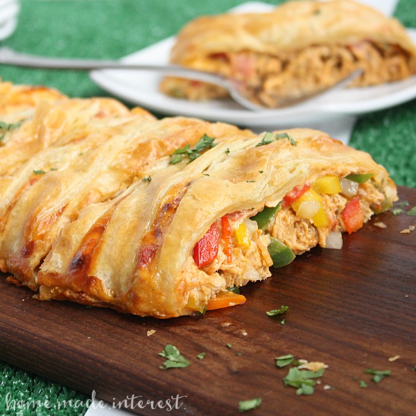 Shredded chicken and cheesy RO*TEL dip braided into a sheet of puff pastry and baked into a delicious chicken taco braid that is the perfect game day recipe for friends and family.