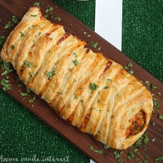 Shredded chicken and cheesy RO*TEL dip braided into a sheet of puff pastry and baked into a delicious chicken taco braid that is the perfect game day recipe for friends and family.