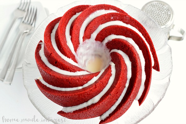 Get ready for Valentine’s Day with this Red Velvet Bundt Cake with cream cheese filling. It is a beautiful and easy Valentine’s Day dessert recipe filled with cream cheese and topped with a cream cheese glaze. It is an amazing red velvet cake recipe for Valentine’s Day!
