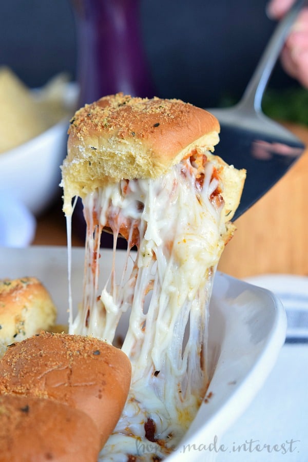 These cheesy Meatball Sliders are an easy appetizer recipe for game day. Make them for your next party!
