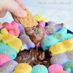 This easy Easter dessert recipe is made with two kinds of chocolate and bunny rabbit peeps, toasted up into an ooey gooey s’mores dip.