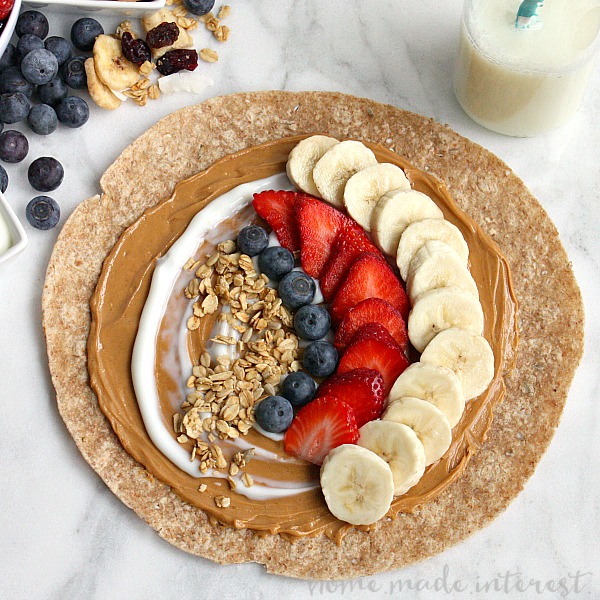 One of the ways I make it through the day is with these easy peanut butter and banana breakfast and snack wraps. You can add any combination of fruits, granola, honey, yogurt, ets to make them into a great breakfast or snack option.