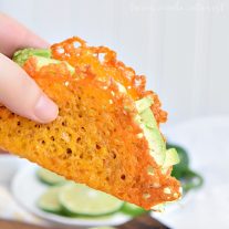 Hand holding a keto taco made with a cheese taco shell