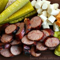 If you love Memphis barbeque then you are going to love this Memphis BBQ Sausage Platter. It is a traditional BBQ appetizer with BBQ grilled sausage, cheese, peppers and pickles. This is a great summer BBQ recipe that is perfect to take to a party or a cookout.