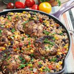 This easy one pot Mexican chicken and rice recipe is filled with tex-mex flavor and cooked with rice, corn, and black beans to make a complete meal in one pot! This chicken recipe is perfect for an easy family dinner.