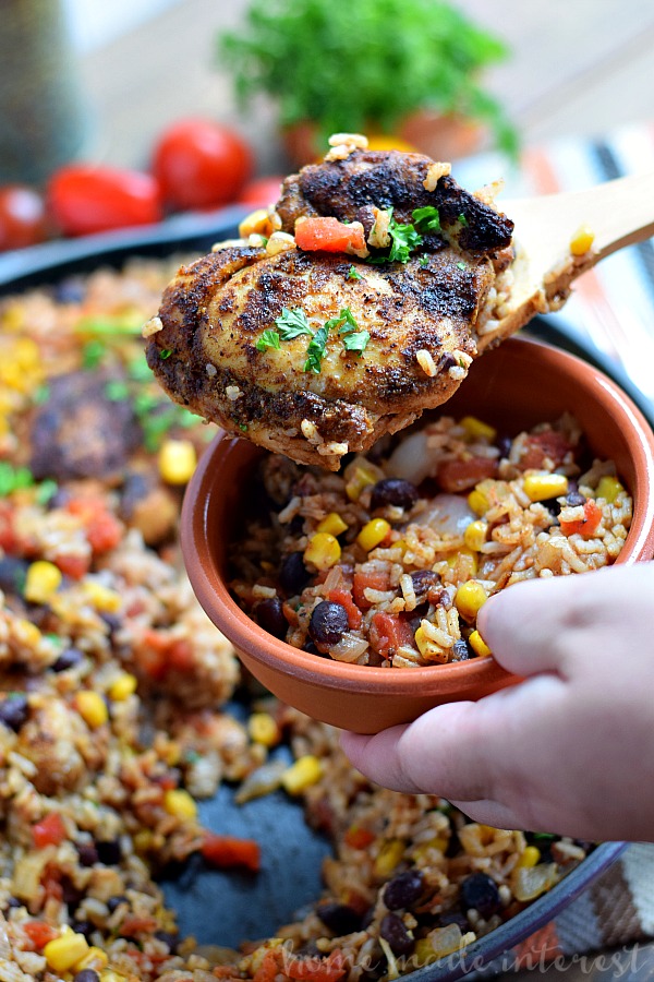 This easy one pot Mexican chicken and rice recipe is filled with tex-mex flavor and cooked with rice, corn, and black beans to make a complete meal in one pot! This chicken recipe is perfect for an easy family dinner.