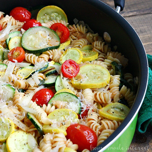 This One Pot Summer Vegetable Pasta is a quick and easy summer dinner recipe that uses fresh summer vegetables like tomatoes, summer squash and zucchini. The pasta cooks with the vegetables in one pot for easy clean up so you have more time to spend on summer fun with the family.
