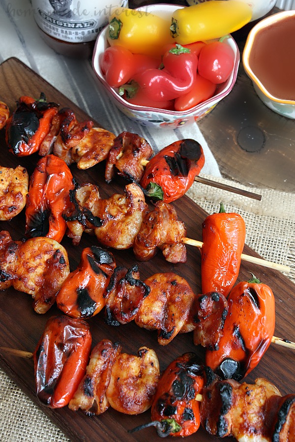 Fire up the grill for this awesome kabob recipe! This grilled BBQ bacon and shrimp skewers are layers of sweet peppers, shrimp and bacon, glazed with your favorite BBQ sauce and grilled over an open flame for a smokey flavor that is out of this world.