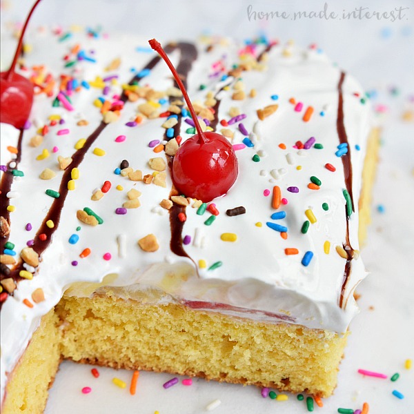Have fun with this easy dessert recipe that kids and adults are going to love. All the flavors of a banana split in a poke cake recipe! Bananas, strawberries, and vanilla pudding covered in whipped cream, chocolate sauce and of course sprinkles with a cherry on top! This banana split poke cake recipe is easy and it is perfect for a birthday cake or a party.
