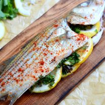 Cedar Plank Grilled Fish is a grilled whole fish full of flavor. This is an easy fish recipe with a lightly seasoned fish grilled on a cedar plank over and open flame. The result is a smokey flavor that will have everyone asking for seconds. Try this easy grilled seafood recipe the next time you fire up the grill.