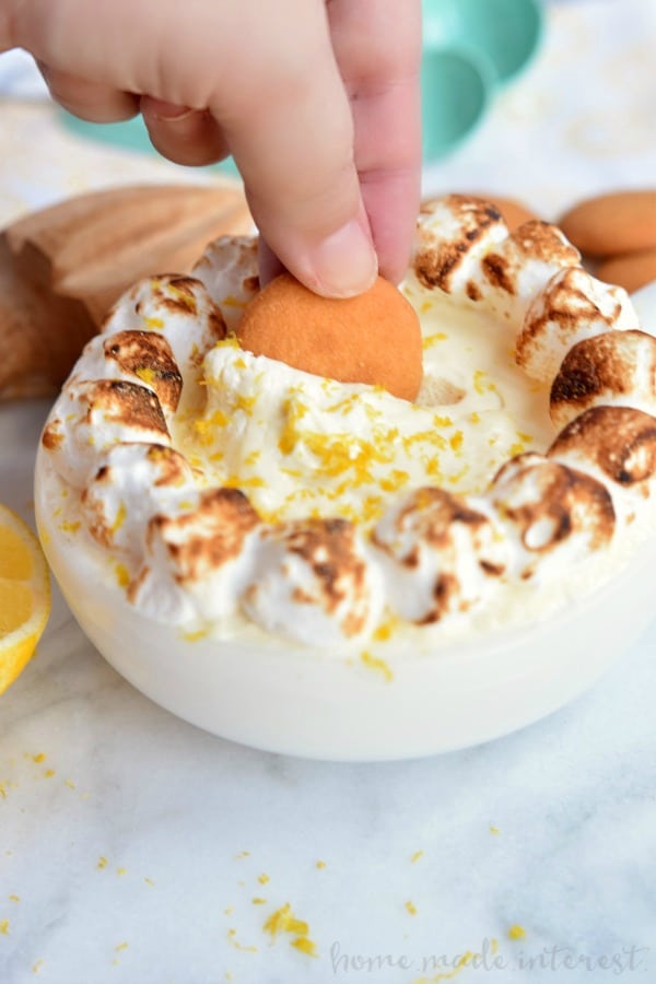 This fluffy Lemon Meringue Dip is a mix of meringue and lemon curd served with graham crackers or cookies. It is a no bake summer dessert that you can enjoy all year long! Take it to your next summer potluck or make it for your friends at your next party.