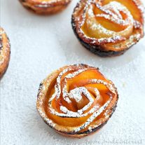 All of the flavors of a peach tart rolled up into beautiful peach rose cups. Puff pastry and fresh peaches and rolled up to create sweet peach roses. This is the perfect summer peach recipe!