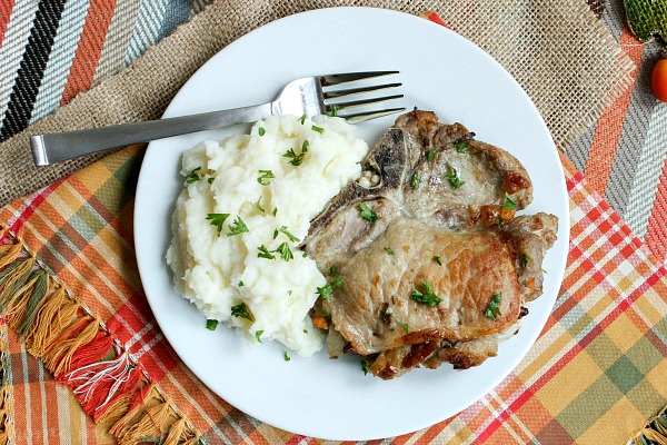These delicious Apple Pecan Stuffed Pork Chops are an easy dinner recipe that everyone in the family will love. The pork goes perfectly with the Apple Pecan Stuffing and it adds so much flavor to the meat. Serve this apple pecan stuffed pork chops recipe with a big helping of mashed potatoes!