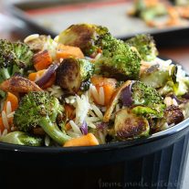 This Roasted Fall Vegetable Orzo is an easy pasta recipe that combines delicate orzo pasta with easy roasted fall vegetables. Cook sweet potatoes, brussels sprouts, and broccoli on a baking sheet in the oven and toss them with orzo for an easy fall recipe that will feed the whole family.