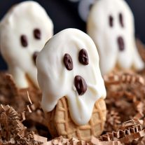 This old school Halloween dessert is the perfect Halloween party food. Kids are going to love these Nutter Butter ghost cookies. Nutter Butter cookies coated in white chocolate or almond bark and decorated with chocolate eyes. Halloween Nutter Butter cookies are delicious and adorable!