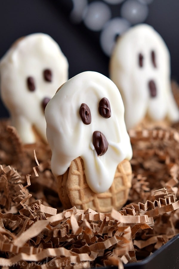 This old school Halloween dessert is the perfect Halloween party food. Kids are going to love these Nutter Butter ghost cookies. Nutter Butter cookies coated in white chocolate or almond bark and decorated with chocolate eyes. Halloween Nutter Butter cookies are delicious and adorable!