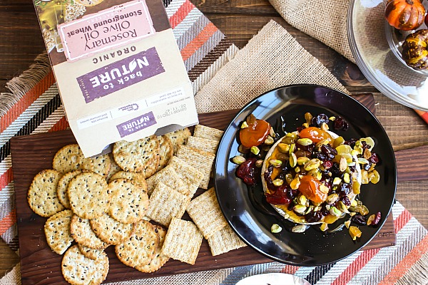 This Dried Fruit and Pistachio Baked Brie is an elegant and delicious appetizer recipe that is perfect for Thanksgiving, Christmas, and New Year’s Eve. The dried fruit and pistachios are coated in a sweet drizzle of honey and placed on top of the melted brie to be served with bread and crackers.