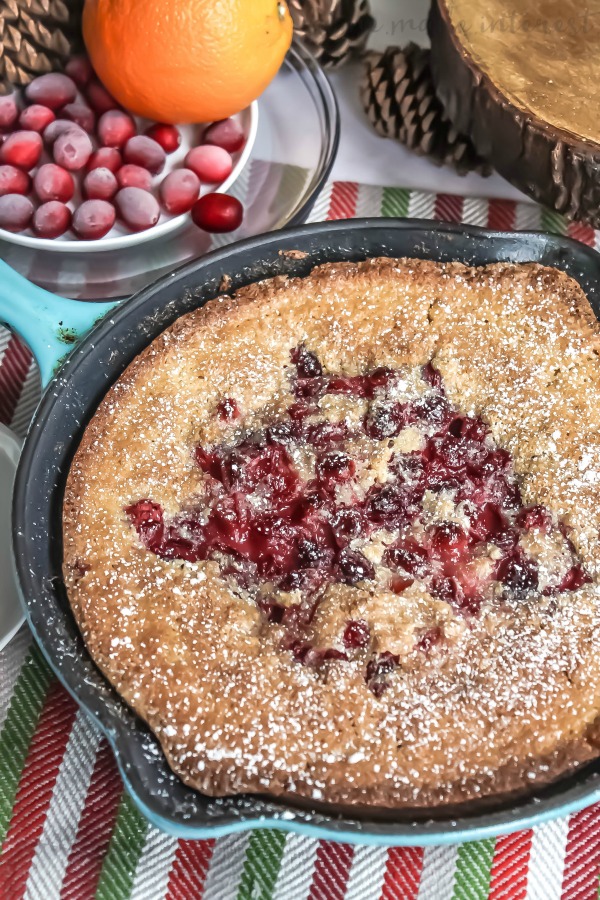 Cranberry buckled in a cast iron pan with cooked cranberries 