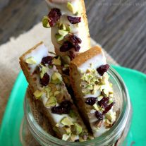 On Christmas morning we wake up early and nothing makes me happier than a big cup of coffee and a homemade Cranberry pistachio biscotti. This easy biscotti recipe can be made ahead of time and it is coated in white chocolate, dried cranberries, and pistachios. I’m loving this easy Christmas basket tutorial, with ideas for creating a Christmas Morning Coffee and Biscotti gift basket with homemade biscotti mix! If you need a Christmas gift idea for a coffee lover this is perfect!