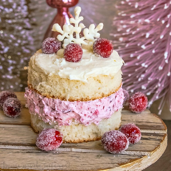 These pretty Mini Cranberry Fluff Cakes are perfect for Thanksgiving dessert or Christmas dessert. The cranberry fluff recipe is one of my favorites and it is even better sandwiched between two slices of cake and topped with white frosting!