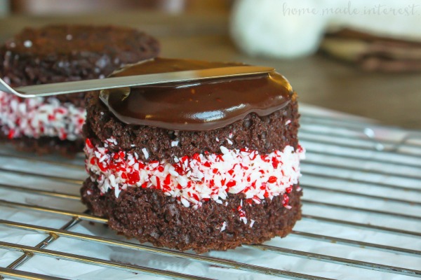 Peppermint Brownie Towers are a peppermint dessert recipe that makes a great Christmas dessert or New Year’s Eve dessert. It is an easy brownie recipe that is quick to make and beautiful to look at. Brownies, frosting, peppermint all topped with a rich, creamy chocolate ganache. This is a peppermint chocolate dessert that everyone will love!