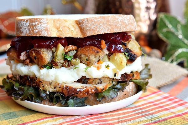 Thanksgiving recipes are amazing but what do you do with all of those leftovers? This Thanksgiving Leftovers Sandwich is layers of turkey, mashed potatoes, cranberry sauce and stuffing all between two slices of bread. Turn your favorite Thanksgiving recipes into this awesome thanksgiving leftovers recipe!