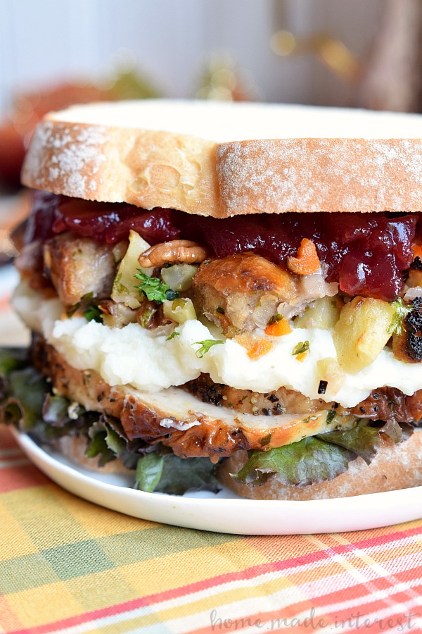 Thanksgiving recipes are amazing but what do you do with all of those leftovers? This Thanksgiving Leftovers Sandwich is layers of turkey, mashed potatoes, cranberry sauce and stuffing all between two slices of bread. Turn your favorite Thanksgiving recipes into this awesome thanksgiving leftovers recipe!