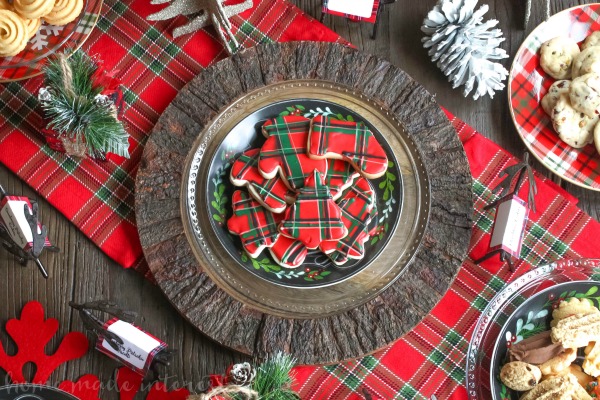 We are Mad for plaid this year and we turned that into a theme for our Christmas cookie exchange. Plaid table decorations, free cookie exchange recipe cards, and plaid sugar cookies. Check out how to host a cookie exchange and download our free printable recipe cards for your next party.