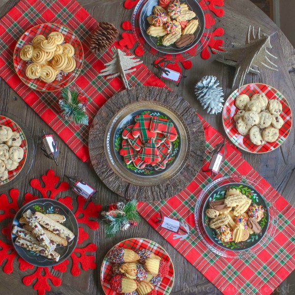 We are Mad for plaid this year and we turned that into a theme for our Christmas cookie exchange. Plaid table decorations, free cookie exchange recipe cards, and plaid sugar cookies. Check out how to host a cookie exchange and download our free printable recipe cards for your next party.