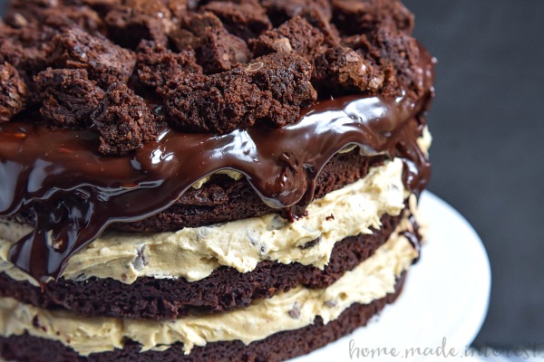 Brownie Chocolate Chip Cookie Dough Cake | This decadent Brownie Chocolate Chip Cookie Dough Cake is made from brownie cake layers filled with no bake chocolate chip cookie dough and topped with a rich dark chocolate ganache glaze. This is a chocolate dessert recipe that you don’t want to miss! Make this easy cake recipe for the chocolate lover in your life!