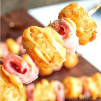 Ham and Cheese Tater Tot Skewers | If you are looking for a simple but totally awesome Game Day appetizer this game day recipe is it. Ham and Cheese Tater Tot Skewers are an easy appetizer recipe with layers of ham and tater tots skewered together and drizzled with creamy american cheese. This is going to be perfect food for your next super bowl party or football party!