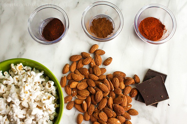Mexican Chocolate Popcorn and Almonds | This sweet and crunchy Mexican Chocolate Popcorn and Almonds is a healthy snack that is easy to make. A blend of spices and chocolate gives this Mexican Chocolate Popcorn and Almonds a sweet flavor with a little bit of a kick and the light popcorn and almonds are healthy snack foods that taste great! 