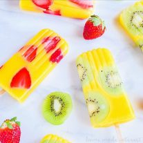 All Natural Mango Popsicles | Fruit popsicles are a great way to get your kids to eat more fruits and to stay hydrated in the summer. These all natural mango popsicles are mixed with kiwi and strawberry pieces for delicious no sugar added fruit popsicles. These beautiful mango kiwi popsicles and mango strawberry popsicles are going to be an awesome summer popsicle recipe for kids and adults!