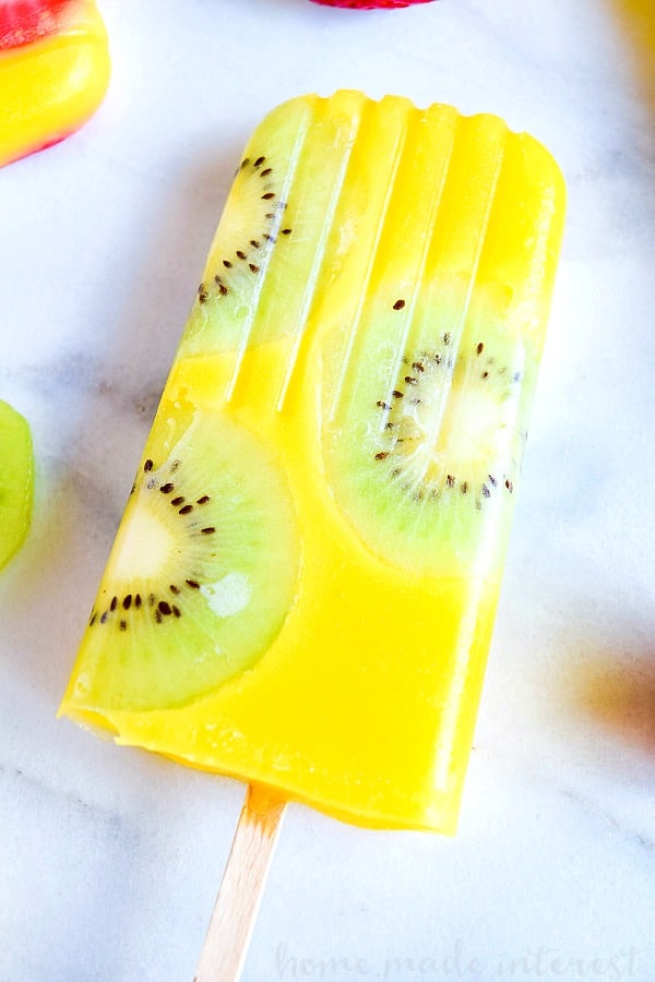 Al natural mango popsicle with kiwi slices