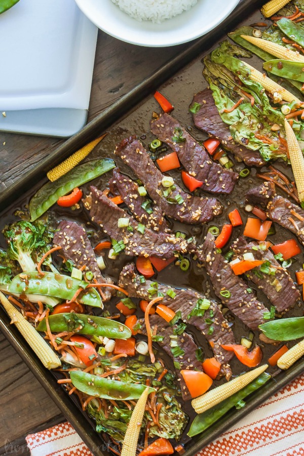 Sheet Pan Beef Teriyaki | This easy sheet pan meal is an easy weeknight dinner recipe that takes less than 30 minutes to make. Sheet pan beef teriyaki recipe is thin slices of beef tossed in teriyaki sauce and baked with asian vegetables. Serve this easy sheet pan dinner recipe over rice or noodles for a quick and easy dinner.