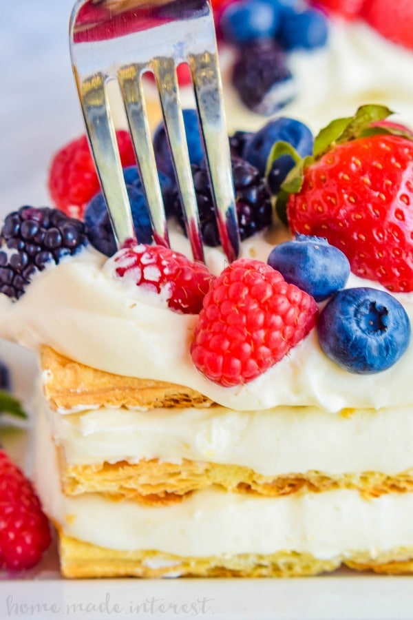 Lemon Berry Napoleons | Lemon desserts are perfect spring and summer dessert recipes! This lemon berry napoleon is layers of lemon mousse and flaky puff pastry stacked together and topped with beautiful fresh fruit. If you have been looking for an easy Napoleon recipe or an easy lemon dessert recipe this is it!