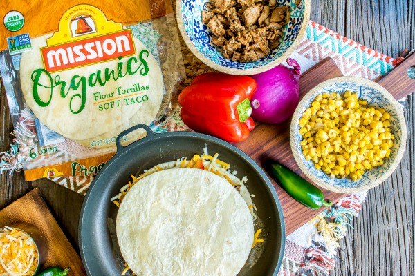 BBQ Pork Quesadillas | This easy quesadilla recipe is oozing cheese and filled with BBQ pork! This is a quick and easy dinner recipe for busy weeknights and a great lunch idea for kids when they are home all summer. These BBQ Pork Quesadillas are an awesome spin on my favorite Tex-Mex recipe!