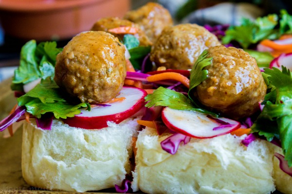 Banh Mi Sliders open-faced with Korean BBQ meatballs on top of pickled vegetables