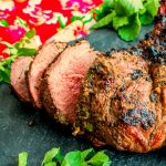 Herb Crusted Grilled Leg of Lamb | This grilling recipe is going to make you the star of your next BBQ! Herb Crusted Grilled Leg of Lamb recipe is a grilled lamb recipe that is packed full of flavor. Learn how to use a Big Green Egg to cook the perfect lamb. An easy lamb recipe that anyone can make.