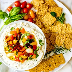 Whipped Goat Cheese and Tomato Dip | This is an easy appetizer recipe that is perfect for summer parties. Whipped Ricotta Tomato Dip combines ricotta cheese and goat cheese with fresh herbs and summer vegetables to make a light, bright summer appetizer recipe that everyone can enjoy. This light cheese dip is a cold appetizer recipe that is perfect for taking to a party.