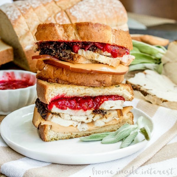 stacked wheat bread turkey grilled cheese sandwich